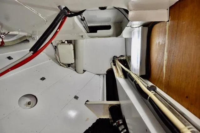 Slide: The Image of Interior view of a 1994 Hutting 40' yacht, showcasing wiring and structural details. - 44