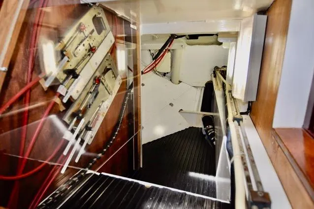 Slide: The Image of Interior view of a 1994 Hutting 40' sailboat, showcasing control panels and wiring. - 45