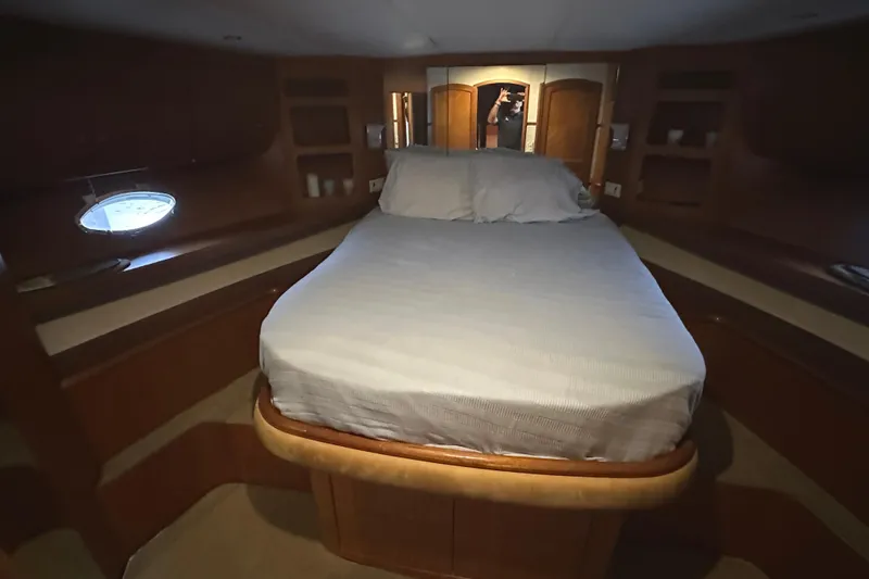 Slide: The Image of Luxurious cabin interior of a 2004 Mikelson 61 PH yacht with a comfortable bed. - 8