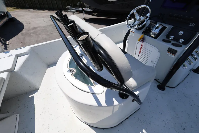 Slide: The Image of 2021 Blazer Bay 2400 boat console with steering wheel and rod holders. - 15