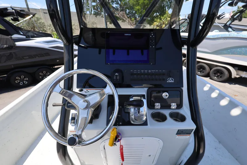 Slide: The Image of Steering console of 2021 Blazer Bay 2400 boat with modern controls and navigation system. - 16