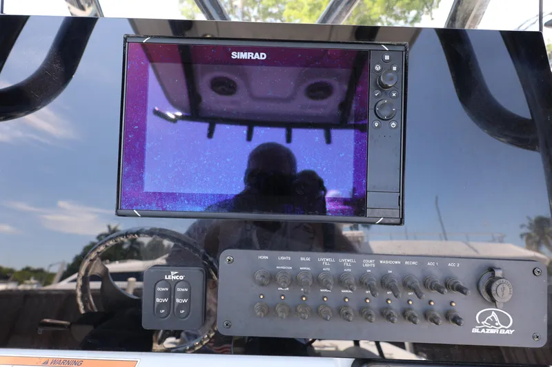 Slide: The Image of Control panel of a 2021 Blazer Bay 2400 boat with Simrad display. - 17