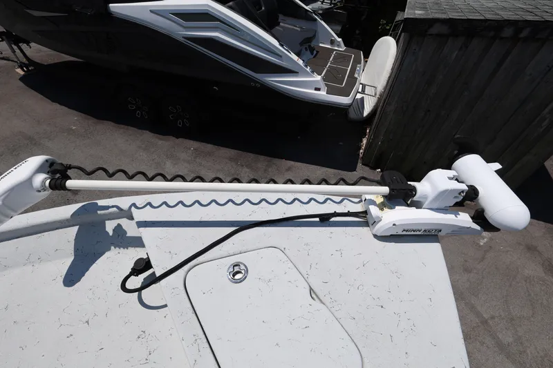 Slide: The Image of 2021 Blazer Bay 2400 boat with Minn Kota trolling motor on deck. - 21