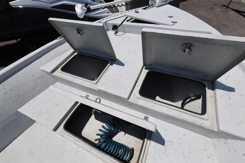 Slide: The Image of Open storage compartments on a 2021 Blazer Bay 2400 boat deck. - 22