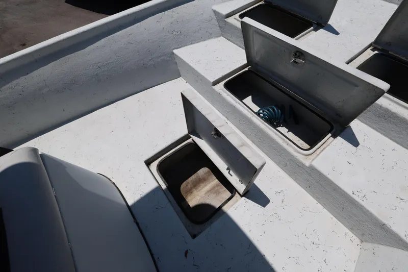 Slide: The Image of Open storage compartments on a 2021 Blazer Bay 2400 boat deck. - 23