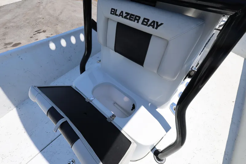 Slide: The Image of 2021 Blazer Bay 2400 boat seat with storage compartment, open on deck. - 24