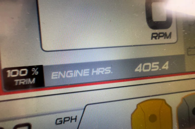 Slide: The Image of Close-up of a Grady-White Marlin 300 engine display showing 405.4 engine hours. - 15