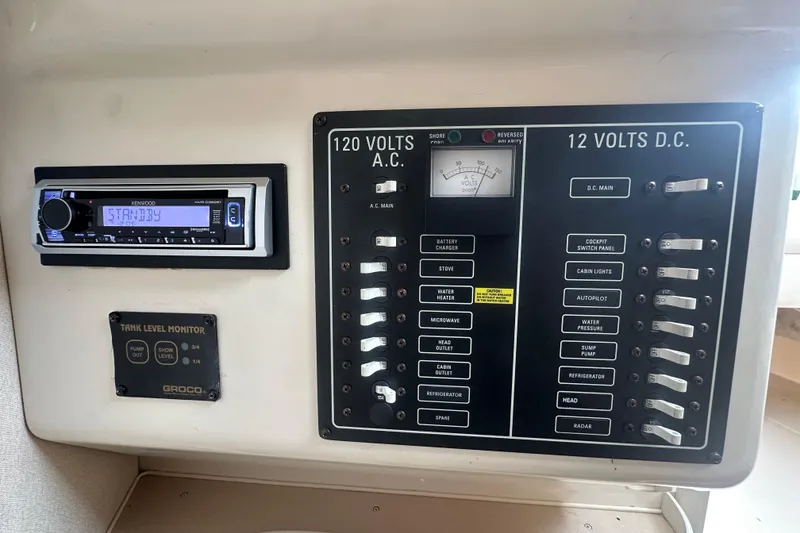 Slide: The Image of Control panel of a 2001 Grady-White Marlin 300 boat with Kenwood stereo and tank level monitor. - 6