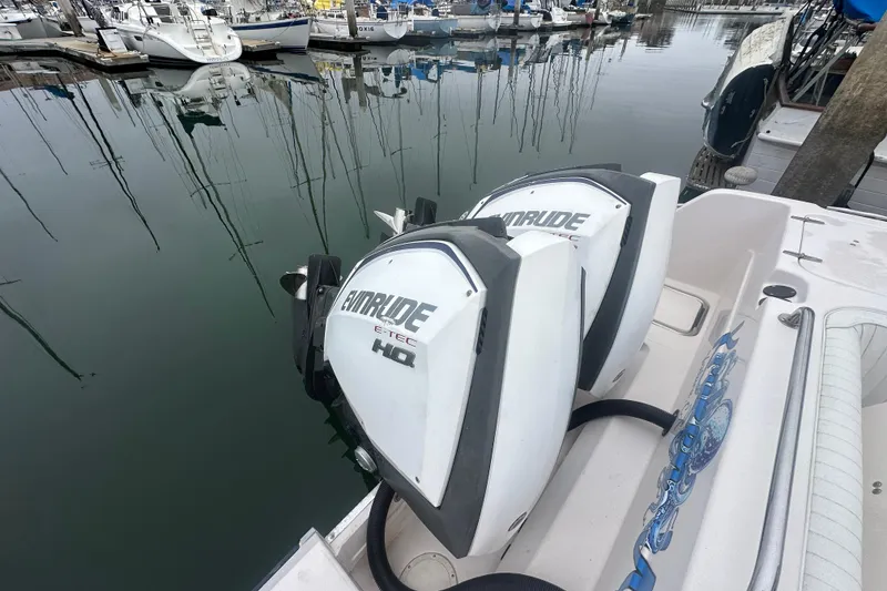 Slide: The Image of 2001 Grady-White Marlin 300 with Evinrude E-TEC engines docked in a marina. - 7
