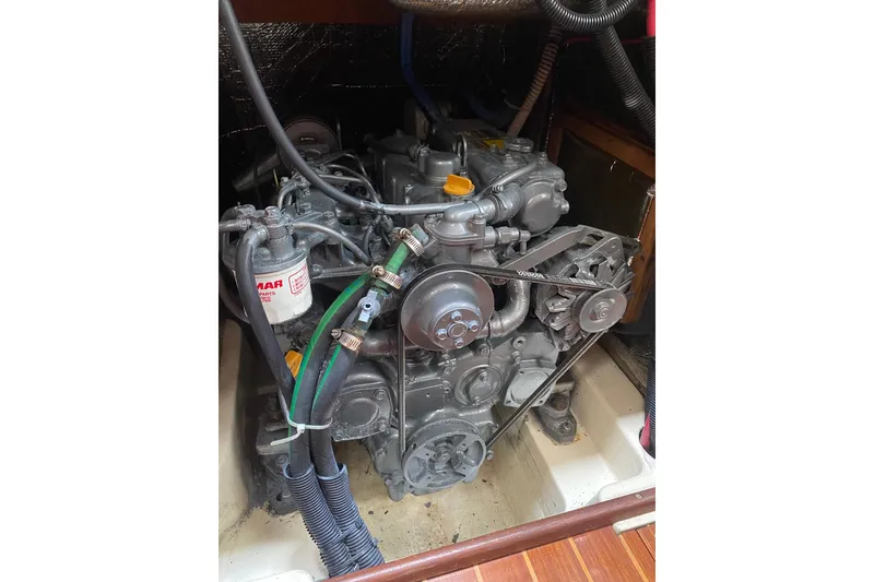 Slide: The Image of Engine of a 1996 Hunter Legend 40.5 sailboat, showcasing mechanical components. - 20