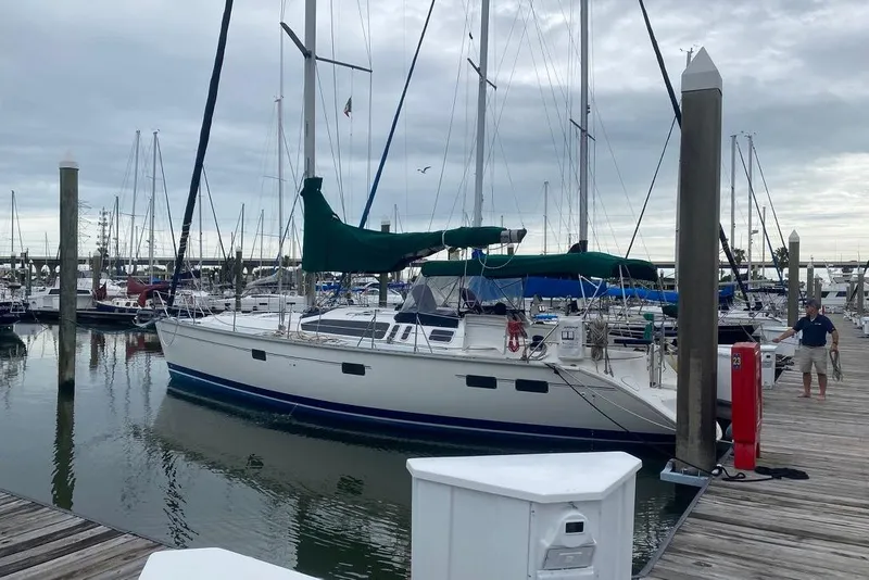 Slide: The Image of Sailboat docked at marina, 1996 Hunter Legend 40.5, overcast sky, calm water. - 4