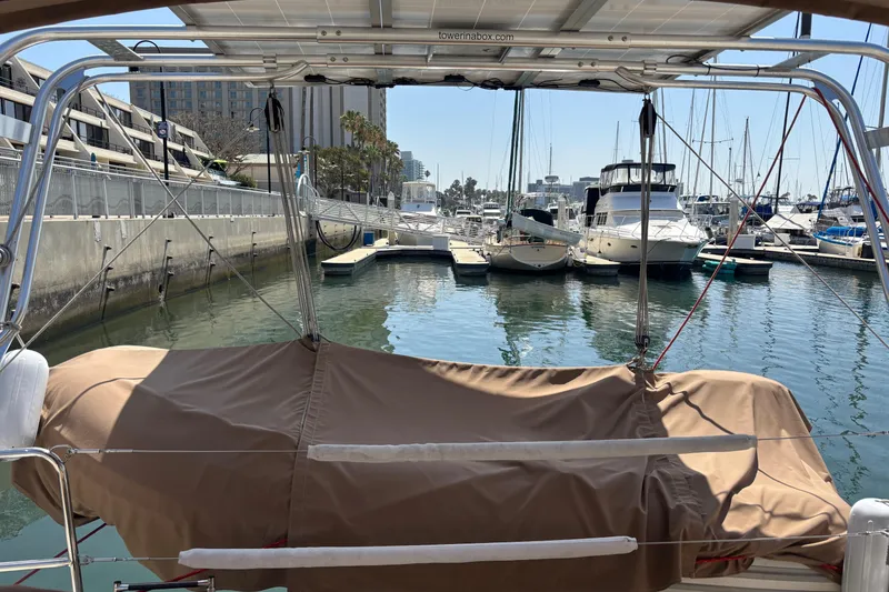 Slide: The Image of Beneteau Oceanis 38 sailboat docked in marina, covered deck, 2017 model. - 14