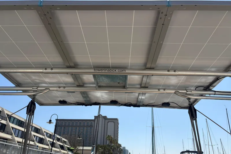 Slide: The Image of Solar panels on a 2017 Beneteau Oceanis 38 sailboat, docked at a marina. - 16