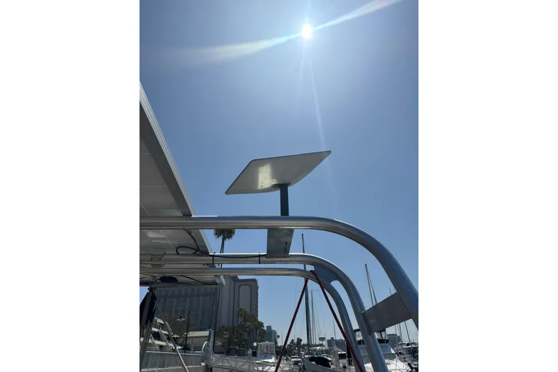 Slide: The Image of Beneteau Oceanis 38 (2017) with solar panel under bright sun at marina. - 17