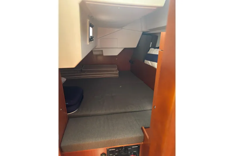 Slide: The Image of Interior cabin of 2017 Beneteau Oceanis 38 sailboat, featuring cozy sleeping quarters. - 18
