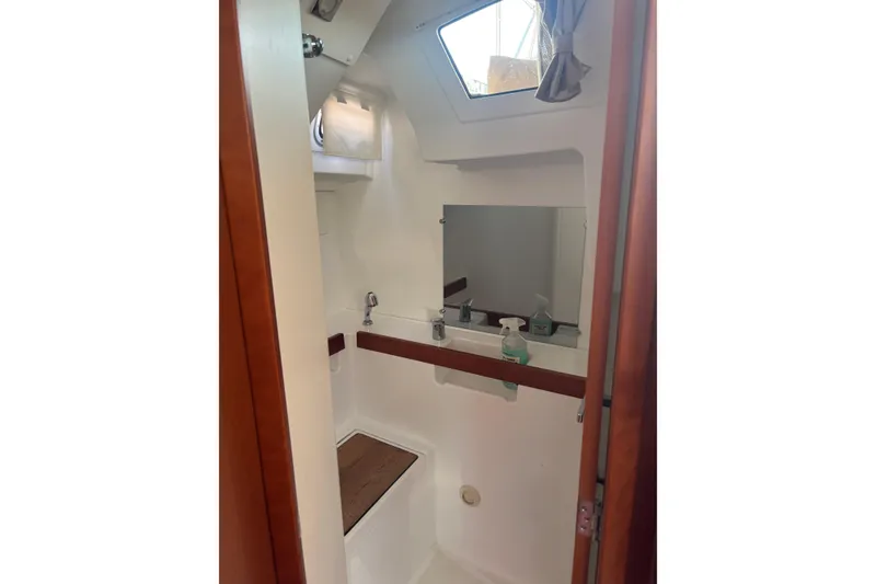 Slide: The Image of Interior of 2017 Beneteau Oceanis 38 yacht bathroom with sink and mirror. - 23