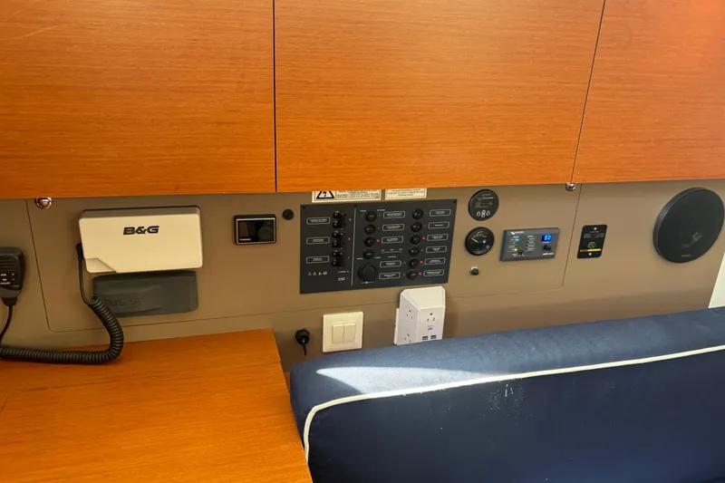 Slide: The Image of Control panel of a 2017 Beneteau Oceanis 38 sailboat, featuring navigation and electrical systems. - 28