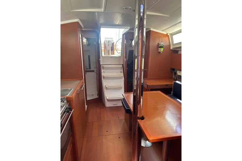 Slide: The Image of Interior of 2017 Beneteau Oceanis 38 sailboat, featuring wood finishes and modern amenities. - 31