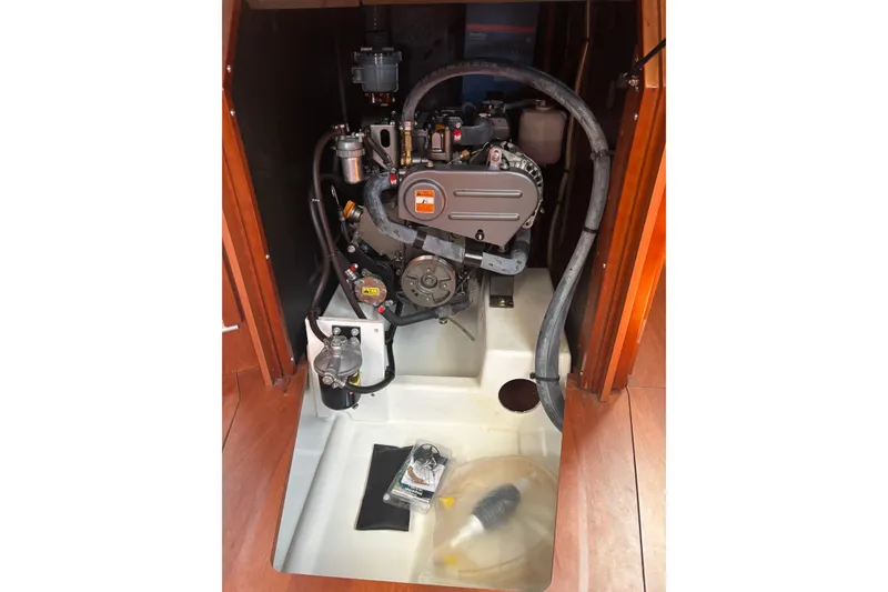 Slide: The Image of Engine compartment of a 2017 Beneteau Oceanis 38 sailboat, showcasing mechanical components. - 32
