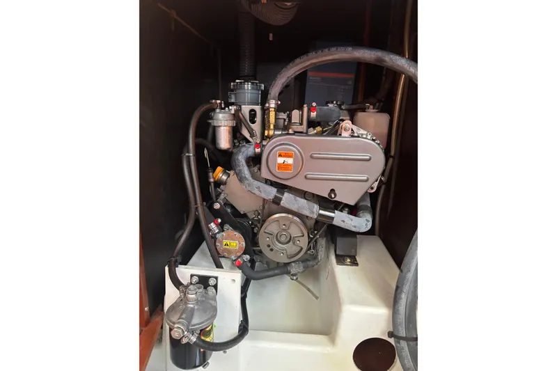 Slide: The Image of Engine compartment of a 2017 Beneteau Oceanis 38 sailboat, showcasing mechanical components. - 33