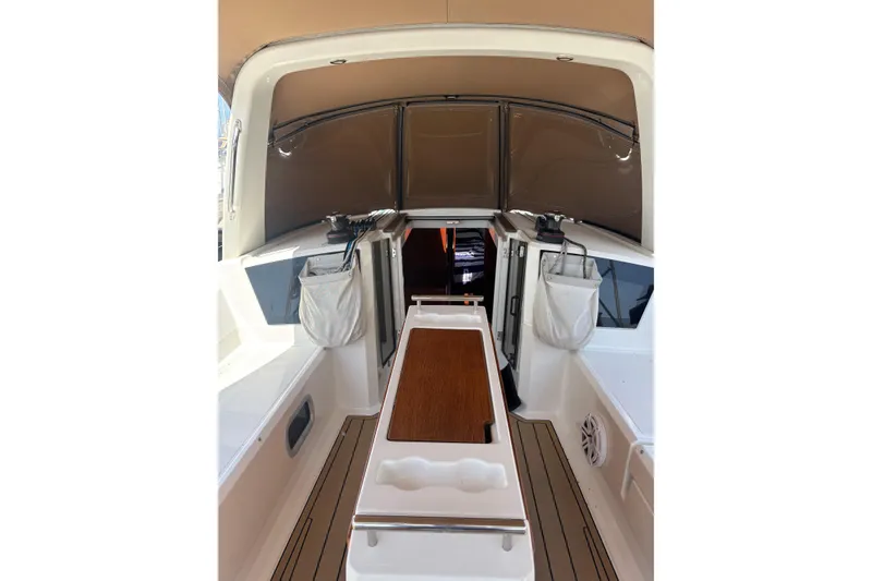 Slide: The Image of 2017 Beneteau Oceanis 38 cockpit with teak flooring and storage compartments. - 34