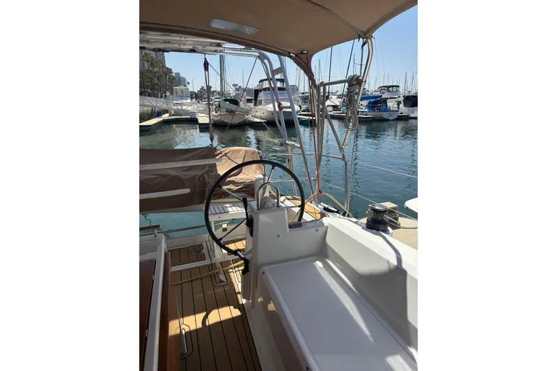 Slide: The Image of Cockpit view of 2017 Beneteau Oceanis 38 sailboat docked at marina. - 35