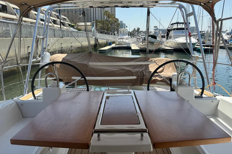 Slide: The Image of Cockpit view of a 2017 Beneteau Oceanis 38 yacht docked at a marina. - 36