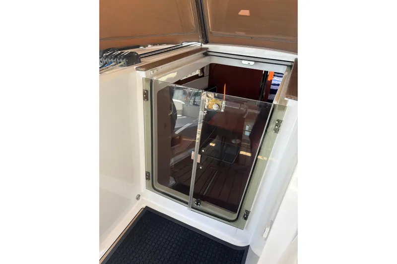 Slide: The Image of Beneteau Oceanis 38 yacht cabin entrance, 2017 model, featuring glass doors and sleek design. - 42