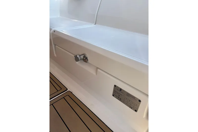 Slide: The Image of 2017 Beneteau Oceanis 38 interior detail with latch and identification plate. - 47