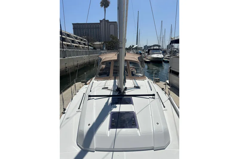 Slide: The Image of 2017 Beneteau Oceanis 38 sailboat docked in a marina, sunny day, clear sky. - 51