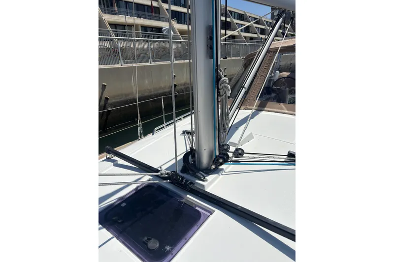 Slide: The Image of 2017 Beneteau Oceanis 38 sailboat deck with mast and rigging details. - 54
