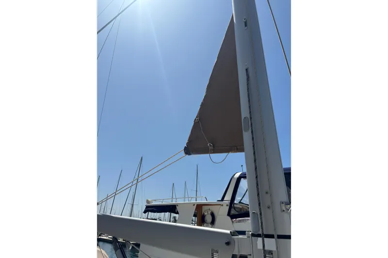 Slide: The Image of Beneteau Oceanis 38 sailboat mast and sail under clear blue sky, 2017 model. - 56