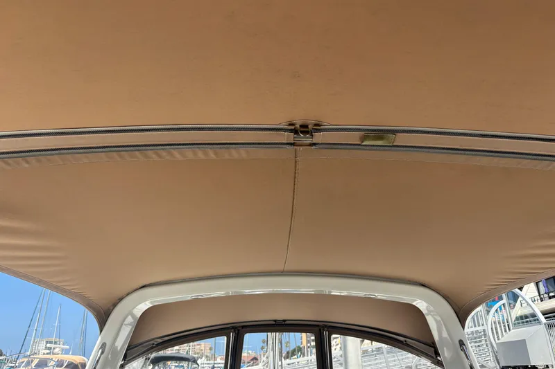 Slide: The Image of Interior view of 2017 Beneteau Oceanis 38 sailboat canopy with beige fabric. - 59