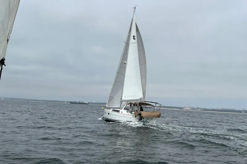 Slide: The Image of Sailing yacht Beneteau Oceanis 38, 2017 model, cruising on open water. - 7