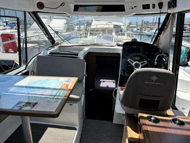 Slide: The Image of Interior of a Jeanneau NC 895 Offshore with table and helm station. - 31