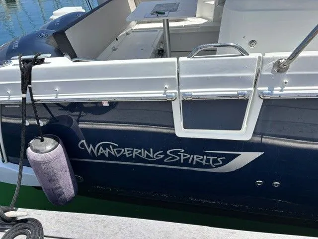 Slide: The Image of The boat "Wandering Spirits" is a 2019 Jeanneau NC 895 Offshore, docked on the water. - 36
