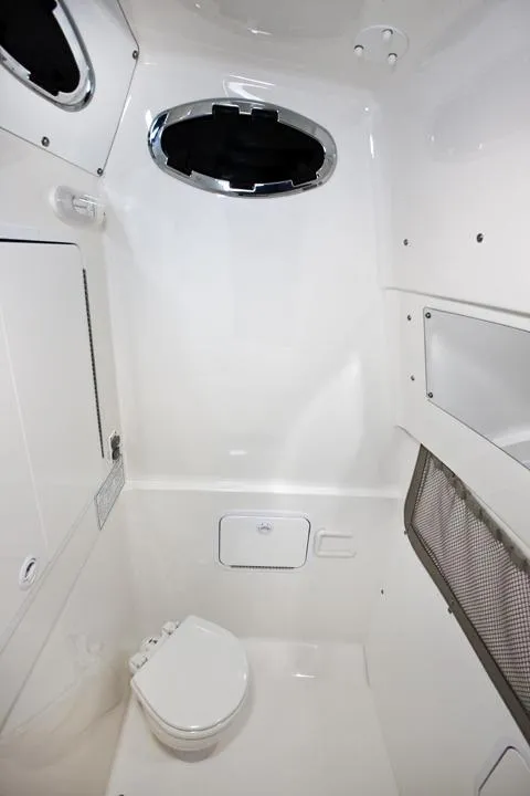 Slide: The Image of Interior of 2016 Regulator 28 Forward Seating with toilet. - 13