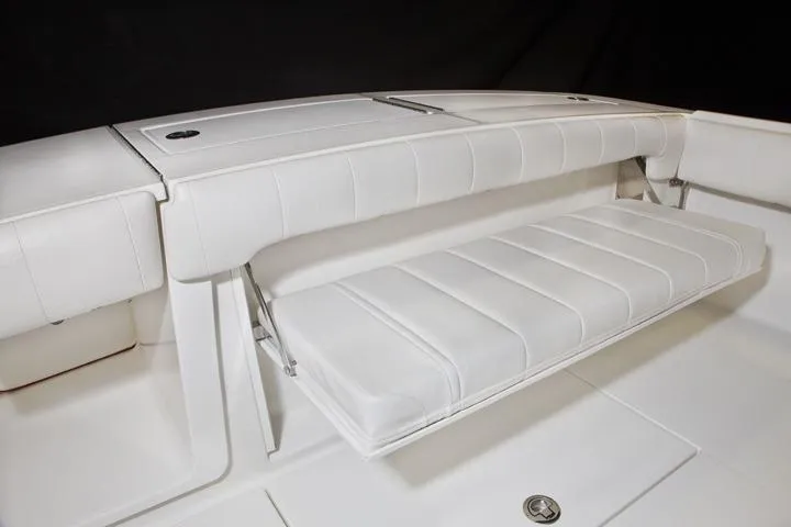 Slide: The Image of 2016 Regulator 28 Forward Seating, white bench seat in boat. - 14