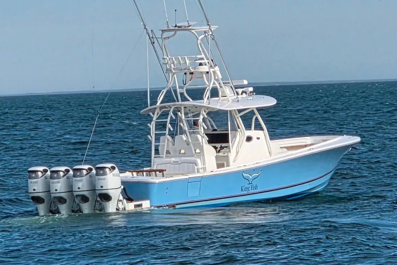 The Image of 2016 Regulator 41 boat with four engines on open water. - 0