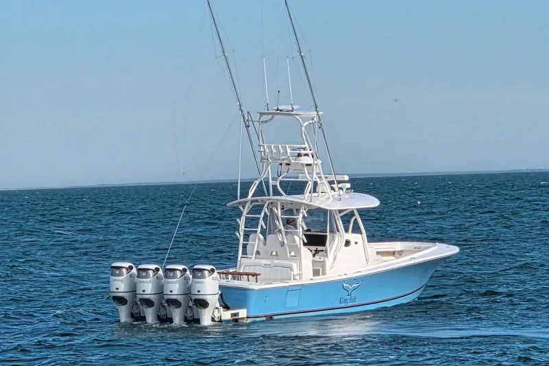 Slide: The Image of 2016 Regulator 41 boat with four engines on open sea. - 1
