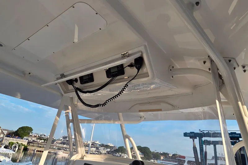 Slide: The Image of 2016 Regulator 41 boat interior with communication equipment and marina view. - 10
