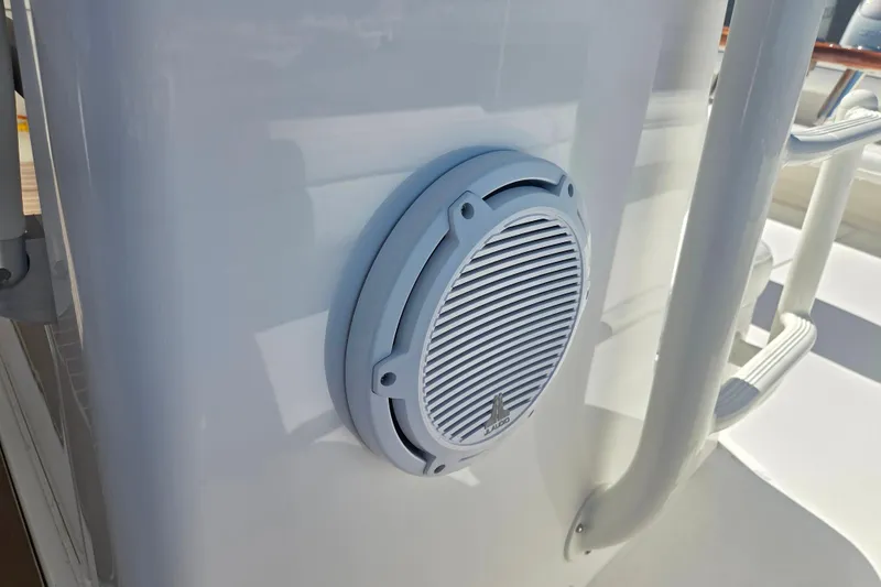 Slide: The Image of Marine speaker on a 2016 Regulator 41 boat, mounted on a white surface. - 14