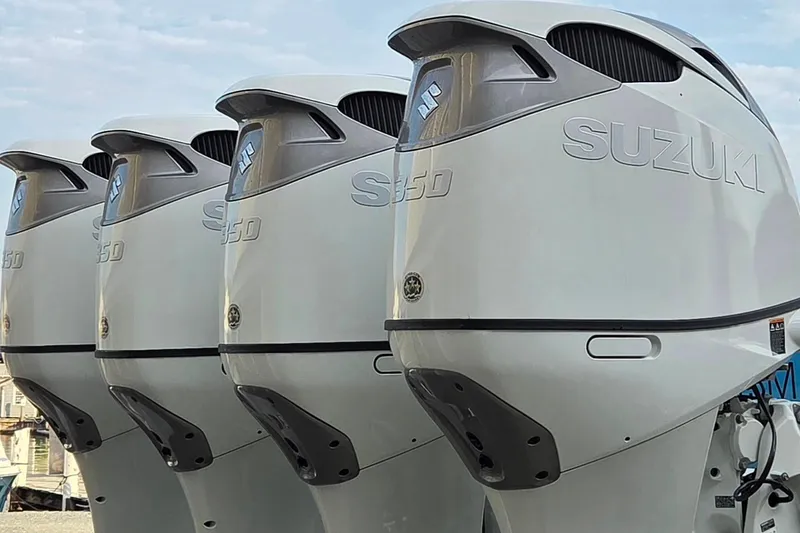 Slide: The Image of Four Suzuki 350 outboard motors on a 2016 Regulator 41 boat. - 21