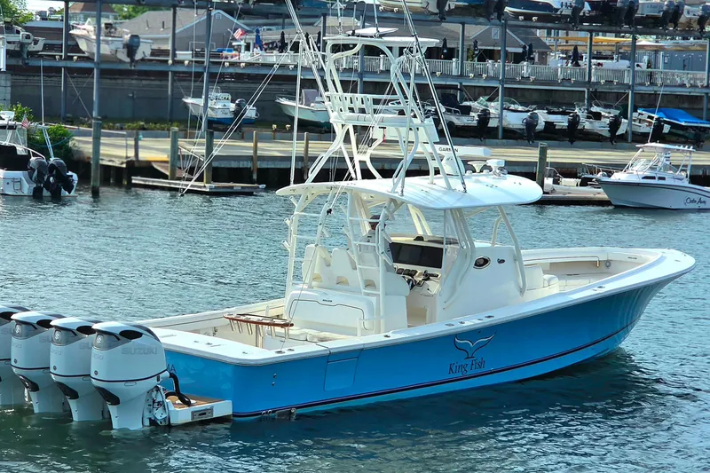 Slide: The Image of 2016 Regulator 41 boat with four engines docked in a marina. - 6