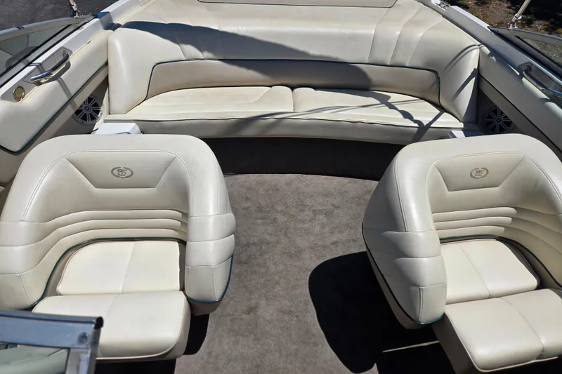 Slide: The Image of Interior of a 1996 Cobalt 232 boat with white leather seating and carpeted floor. - 5