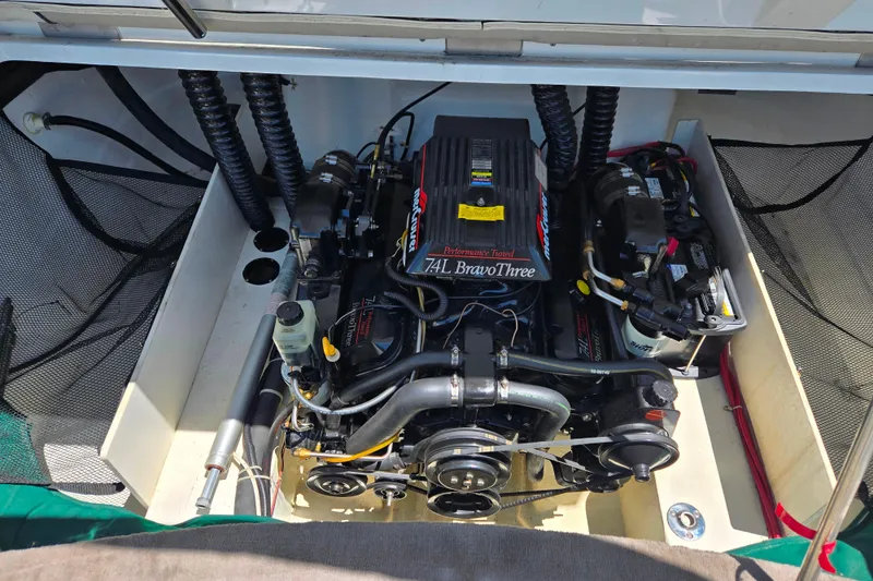 Slide: The Image of Engine compartment of a 1996 Cobalt 232 boat, featuring a 7.4L Bravo Three engine. - 8