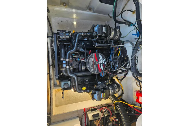 Slide: The Image of Engine compartment of a 2006 Bayliner 265 boat, featuring a Mercury 5.7L engine. - 20