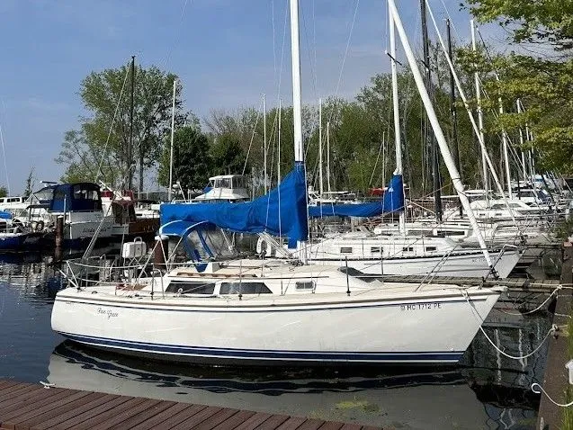 Slide: The Image of 1990 Catalina 28 sailboat docked in marina. - 1