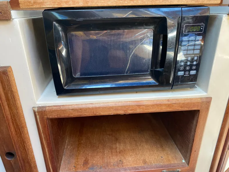 Slide: The Image of Microwave in Catalina 28 boat kitchen, year 1990. - 49