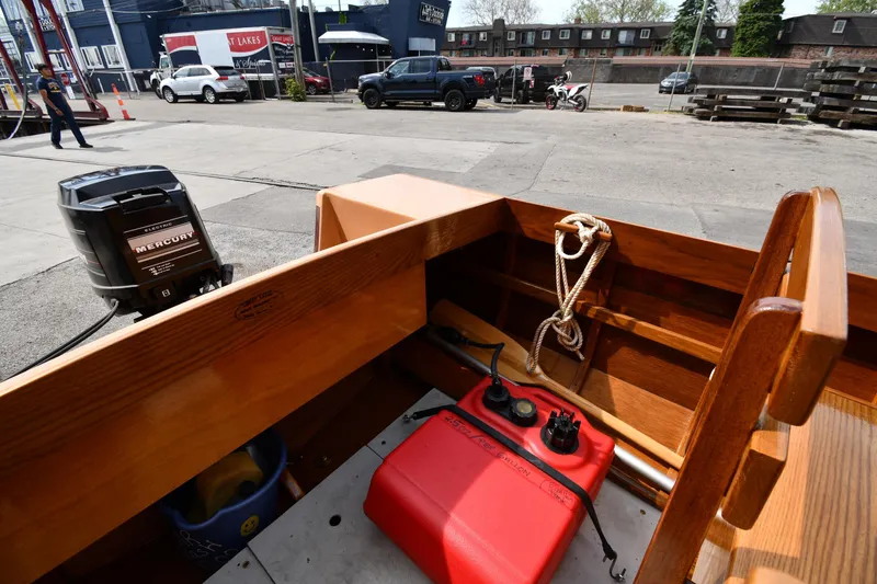 Slide: The Image of 2003 Great Lakes 16 Skiff with Mercury motor, docked in urban setting. - 10